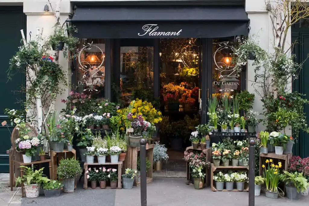 Florist arranging same-day delivery orders at a Queen West shop